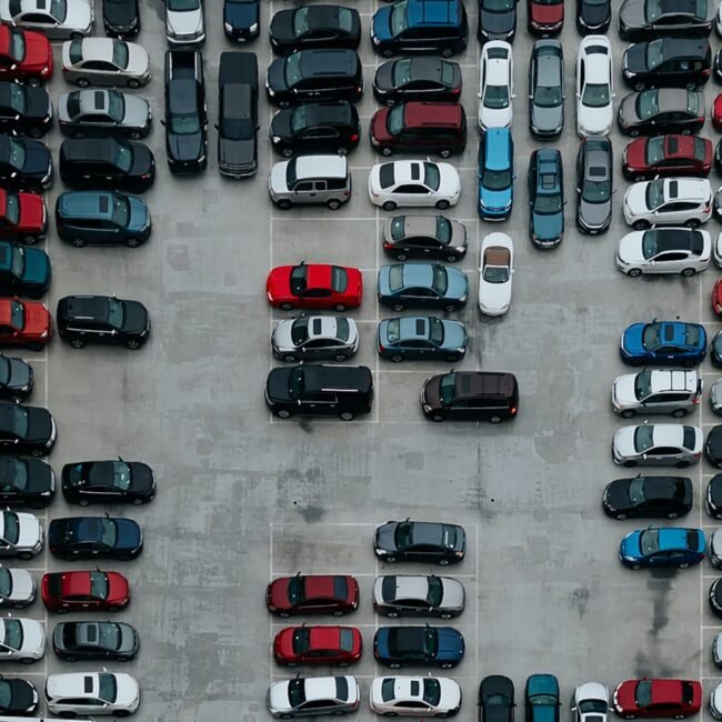 Multiple cars in parking lot.