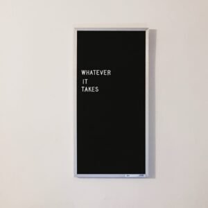 Black word board with "Whatever it takes" written.